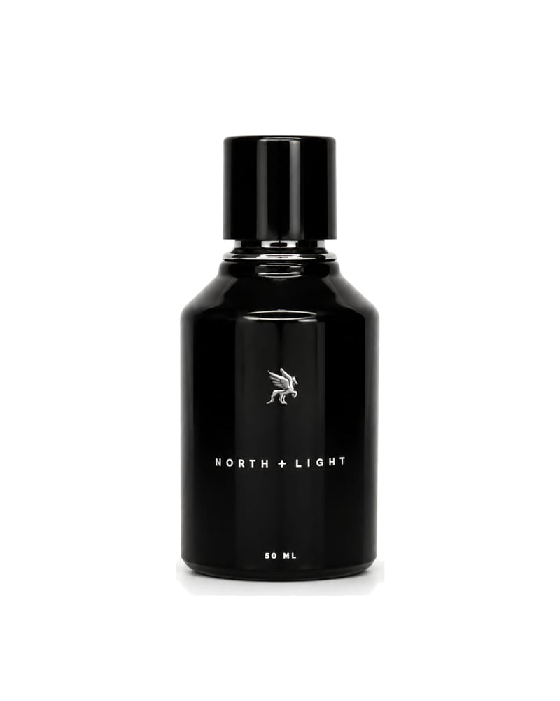 North + Light eau de parfum, the black Stellare flacon on a white ground